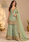 Sage green embellished sharara suit on model